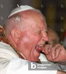 Image of POPE JOHN PAUL YAWNS AT THE SACRED HEART'S CATHEDRAL IN