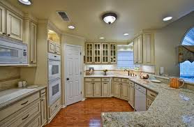 Cottage kitchen designed and trimmed with a blue bead board island topped with a white quartz countertop for a charming appeal. 15 Dainty Cream Kitchen Cabinets Home Design Lover