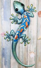 Shop the finest authentic rustic furniture, mexican furniture, talavera tile and pottery, mexican tin mirrors, and more. Ebros Large Crawling Green Metal Lizard Gecko With Blue Glass Body Wall Decor 18 5 Long Designer Copper Metal With Art Glass Home Decorative Wall Art Plaque Decor 3d Buy Online In Guatemala At