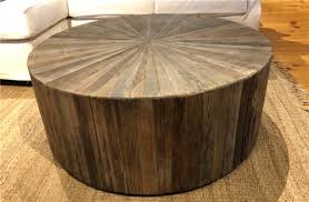 A polished brass finish brings a rustic, yet modern look to a stainless steel base. Recycled Elm Round Coffee Table