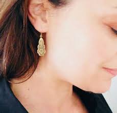 Gold Victorian earrings with scrolled floral paddle dangles