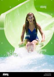 Girl on waterslide hi-res stock photography and images - Alamy