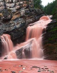 The Cameron Falls Located Inside The Waterton Lakes National Park In Alberta Canada Turn Red When With Images Waterton Lakes National Park Waterfall Beautiful Waterfalls