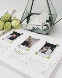 A guest book that can be filled with memories as well as signatures, this cool and alternative clear polaroid guest book is a perfectly modern guest register option for the bride and groom. Personalised Wedding Guest Book By Pearl Mason Notonthehighstreet Com