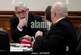 Defense attorney Robert Barfield talks with attorneys Katy-Marie Lyles and  Nicholas Poehl before the change of venue hearing for their client  Dimitrios Pagourtzis, the Santa Fe High School student accused of killing
