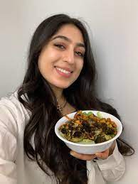 Samah Dada roasts a bunch of veggies in masala spices for dinner in a bowl
