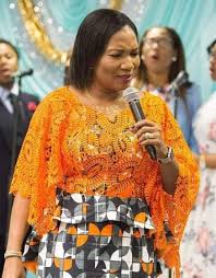 One of the days I went to market to buy soup things. Walking along the  stalls, I saw this beautiful gown. So beautiful and glittering. I had no  money to get the