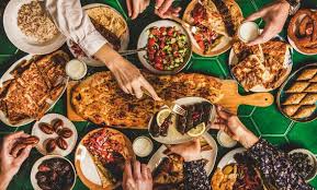 Young happy family talking while having lunch at dining table. Pin On Graphics Patterns Inspiration