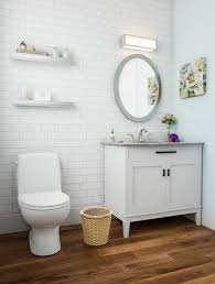 White And Mint Green Powder Room Warm Wood Flooring Wood Floor Bathroom Small Bathroom Makeover