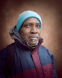 Motivated by religious zeal, this man is the operator of what was called a  “flop house” in 1935 when this photo was made. Today, we would call it by  the kinder name “