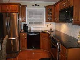 Kitchen remodeling done with cabinet refacing. Chosing A Backsplash With Black Granite Counters Kitchens Forum Gardenweb Trendy Kitchen Backsplash Trendy Kitchen Tile Black Granite Kitchen