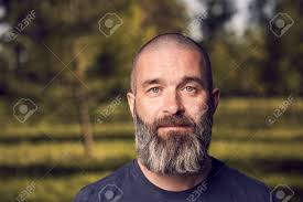 A stubble beard is a short, masculine, and trendy facial hair style created two ways. A White Man About 43 Years Old With Short Hair And Beard Has A Rest In A Park Close Up Stock Photo Picture And Royalty Free Image Image 124464006