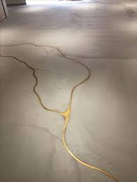 Concrete Floor Cracks Filled With Liquid Gold Resin Kintsugi Concrete Floors Floor Design