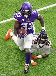 Dalvin Cook Of The Minnesota Vikings Runs With The Ball As Eddie Minnesota Vikings Vikings Football Minnesota Vikings Football