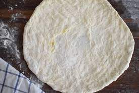 How To Use Your Hands To Stretch Pizza Dough
