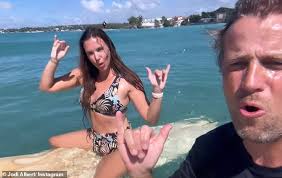 Bikini-clad Jodi Albert shows off her impressive surfing skills with  husband Kian Egan as they enjoy lavish Barbados getaway