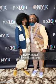 Justin Haynes poses with a guest at ECRU The Classic Shades of... News  Photo