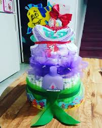 The little mermaid is one of my favorite disney character. Diy Little Mermaid Diaper Cake Ariel Diapercake Mermaid Baby Shower Theme Baby Shower Diaper Cake Baby Shower Planning