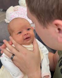sweet baby Charlotte is one month old today and I am NOT ok😭. our smiley  girl loves to snuggle, to have her hands