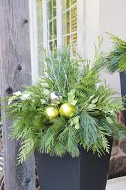 Use a combination of living plants and natural materials. 24 Colorful Outdoor Planters For Winter Christmas Decorations A Piece Of Rainbow