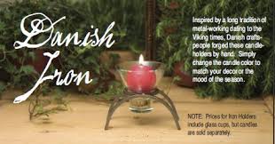 Stunning and one of a king wrought iron candelabra that holds 12 candles.the piece has beautiful lines and seats on a tripod. Danish Iron Candle Holders