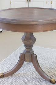 When you're done stripping the table, sand the surface in the direction of the grain to even out any discoloration or irregularities. Refinishing A Table How I Brought My Beat Up End Table Back To Life Driven By Decor