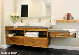 This rustic diy bathroom vanity designed by build something combines the rustic look of pine with the contemporary look of a square sink to make a vanity this smaller bathroom vanity uses turned legs and has two cabinet doors, giving you lots of storage for such a small space. How To Build A Diy Modern Floating Vanity Or Tv Console