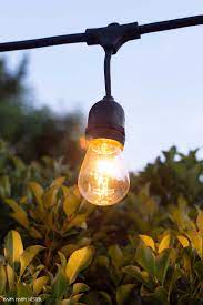 Learn how to hang string lights or christmas lights without using nails on almost any surface. How To Hang Outdoor String Lights Happy Happy Nester