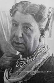 Who is Alfred Hitchcock dressed as in this photo?