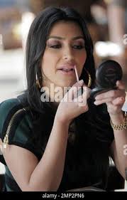 Kim Kardashian and sisters Khloe and Kourtney enjoy a meal at Toast. After  eating, the girls touch up their makeup before heading to the Hillary Rush  boutique for a bit of shopping.