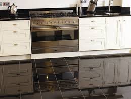 High Gloss Black Granite Tiles Kitchen Floor White Kitchen Cabinet Home Kitchens Kitchen Plinth Flooring