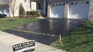 Want to know how much it costs to lay a concrete driveway? How Much Does It Cost To Seal An Asphalt Driveway Asphalt Driveway Driveway Sealing Driveway