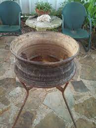 These diy firepits are budget friendly. A Ruined Big Truck Rim With Legs Welded On It Paint It And You Ve Got A Fire Pit Fire Pit Rustic Planters Fire Pit With Rocks