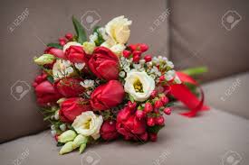 Maybe you would like to learn more about one of these? Beautiful Wedding Bouquet Of Red Tulips Lying On The Sofa Stock Photo Picture And Royalty Free Image Image 43152770