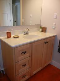 2 door single bowl vanity with drawers on right shown in tiger maple wood with our fireside finish. Bathroom Gossling Woodworking Decorah Waucoma