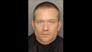 Man who ditched clothes after robbing bank turns himself in, police say