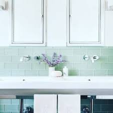 A traditional master bathroom has a modern feel with clean white subway tiles and herringbone mosaic. 20 Decorative Tile Glass Ideas Decorative Tile Glass Tile Glass