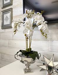 Orchids floral arrangement in vase simple yet impressive, this phalaenopsis silk orchid with succulents floral arrangement features four lush stalks of silk phalaenopsis orchids intertwined with curly willow tendrils for an airy effect. Diy Faux Orchid Arrangement Designs By Jeana
