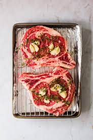 Then mix salt, pepper, dried thyme, and garlic with a dash of olive oil, and rub it on the meat to season it. How To Cook Ribeye Steak In The Oven Lenaskitchen