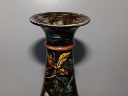 Sold at Auction: A pair of Doulton Lambeth 'faience' vases by Walter Gandy,  decorated overall floqwering foliage