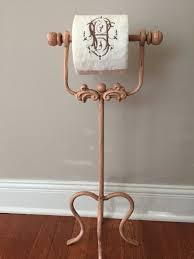 These toilet paper holders range from wall mounted metal units all the way to freestanding granite ones, so buckle up and let's get started. Reserve For Diane Old Pink Free Standing Toilet Paper Holder Ornate Metal Toilet Paper Holder Shabby Chic Bathroom Decor Toilet Paper Holder Shabby Chic Bathroom Decor Chic Bathroom Decor
