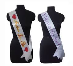 During a maternity photo shoot; Buy Sash Online Atpata Funky Baby Shower Sash Combo