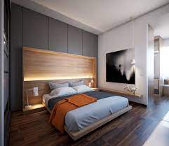 Arredamento camera da letto in bianco e nero classico con un letto doppio con piumone disfatto, lunghe finestre con tende, un camino con specchio sopra mensola del camino, una cornice modanata e parquet. 100 Idee Camere Da Letto Moderne Colori Illuminazione Arredo Camera Moderna Start Preventivi