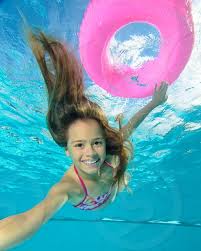 Girls and women swimming underwater. A Young Girl Swimming Underwater In The Pool By Jeremy Sterk Photo Stock Snapwire