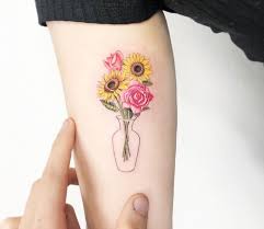 You can be loyal to yourself and to your love with a sunflower tattoo and rose. Roses And Sunflowers Tattoo By Kozo Tattoo Post 30444