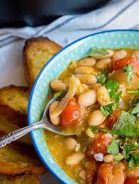 Hearty Roasted Tomato And White Bean Stew Recipe In 2020 Bean Stew Delicious Vegetables Roasted Tomatoes