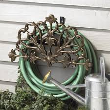 Durable hose butler with a decorative star. 17 Garden Hose Storage Solutions Hgtv