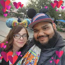 Tis a season of change, grief, complexity, and somehow... moments of free  expression. Hair is in good hands with @iamnattyjackson! Alt text: In the  first image, Alyson stands in front of floral