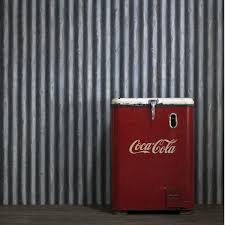 This cool toned corrugated metal wallpaper will add an instant industrial flair to your space. Palmer Steel Wallpaper Andrew Martin
