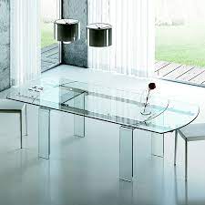 Solid and heavy, table in excellent condition, chairs in good condition, couple of little marks on them. Lauren Luxury Glass Extending Dining Table Robson Furniture
